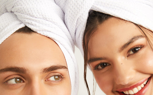 Two people wearing the microfibre hair towel