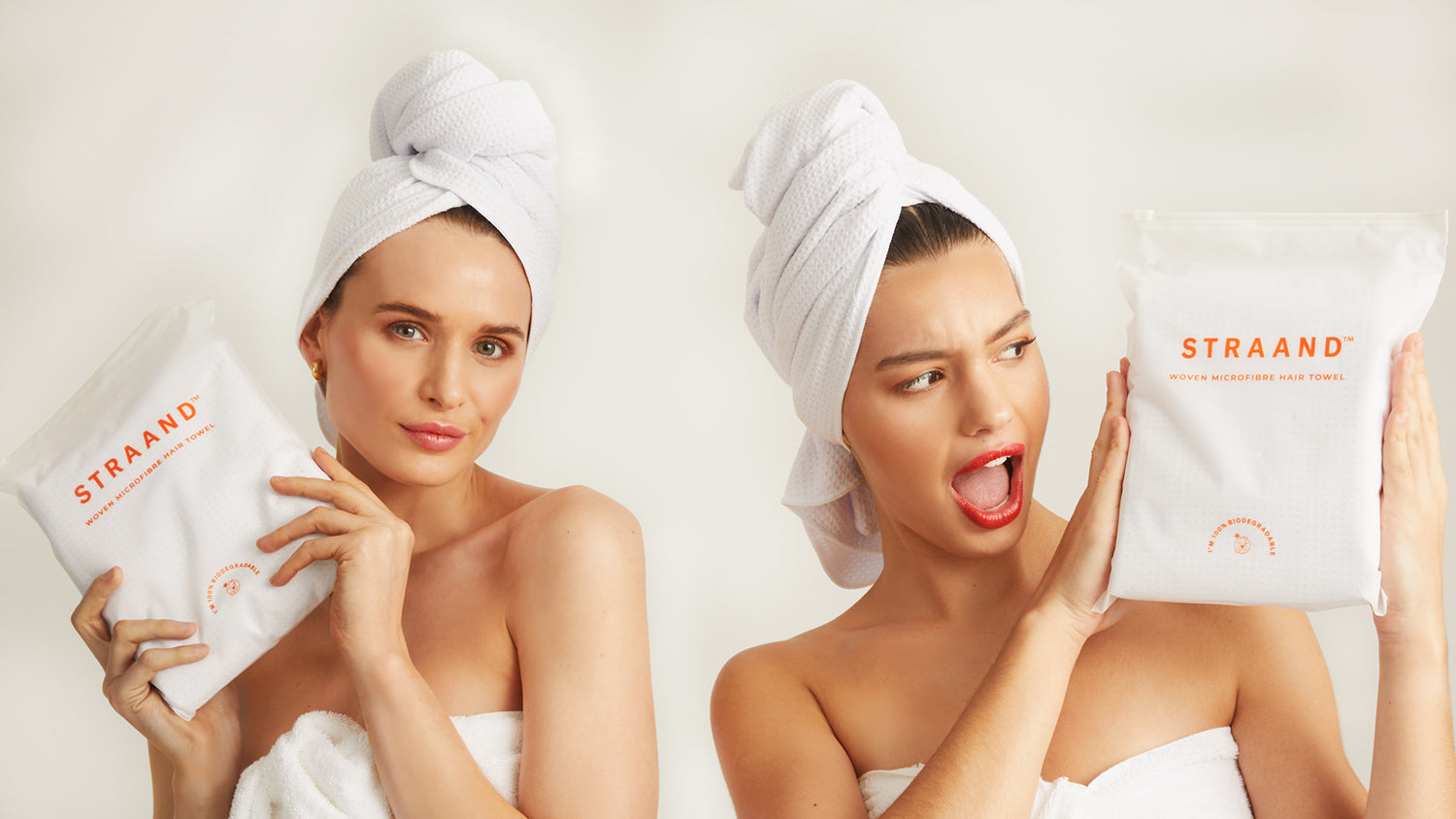 Two brand models holding the Microfibre Hair Towel with happy facial expressions