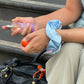 Hair perfume being pulled out of a handbag