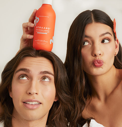 Two brand models with Straand Shampoo and Hair clips