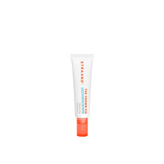 A mini-sized tube of Crown Fix Scalp Serum with a white body and orange cap, labeled with the product name and branding.