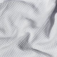 Close-up of a textured gray fabric surface